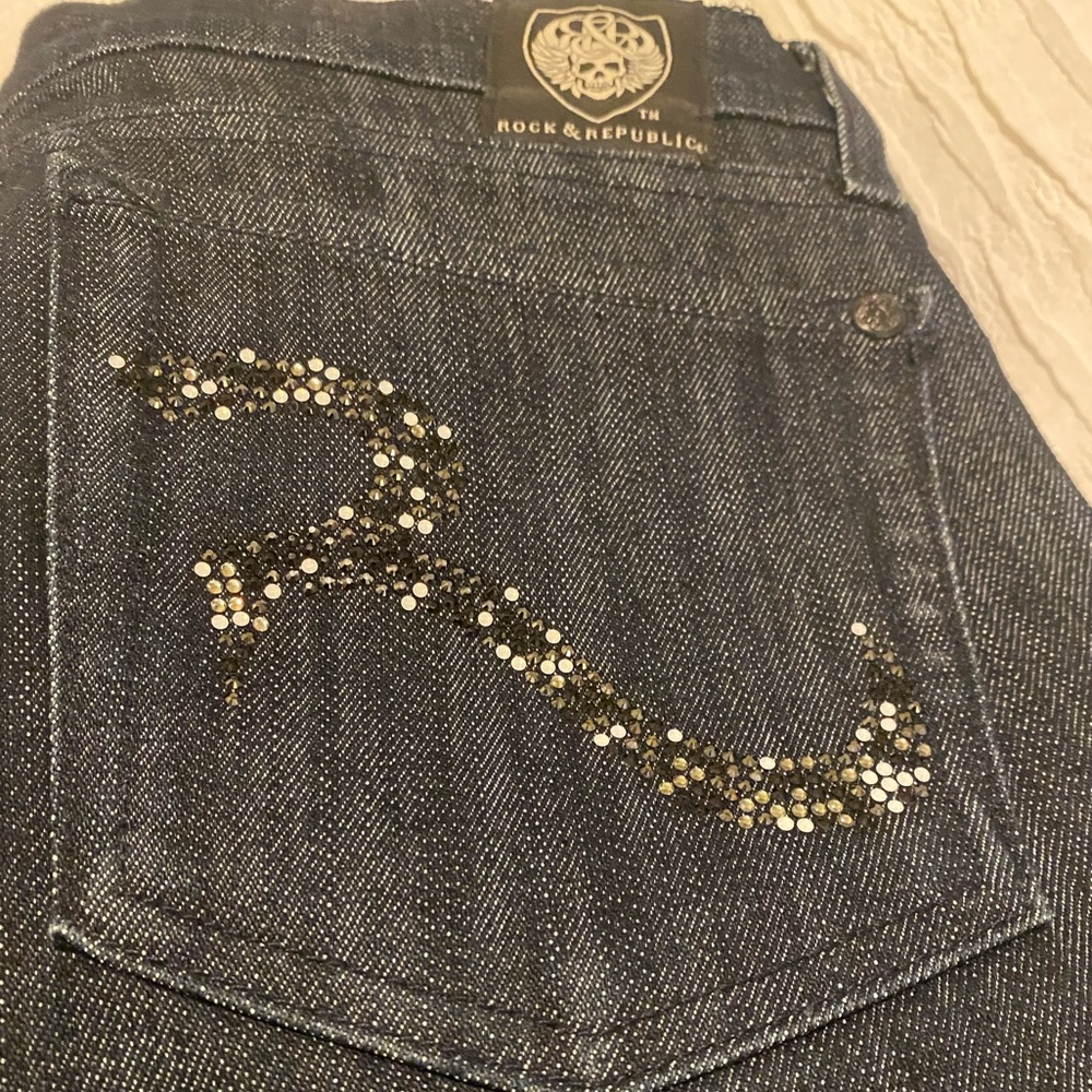 Rock & Republic dark denim bell bottom jeans with Swarovski crystal logo